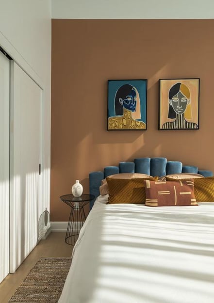 Beautifully painted bedroom with warm terracotta walls Beautifully painted bedroom with warm terracotta walls