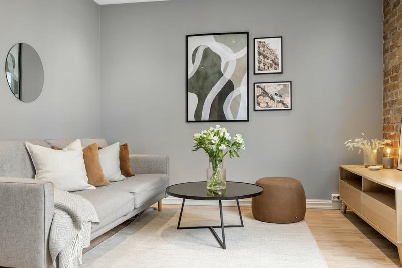 Modern living room with gray walls and neutral tones